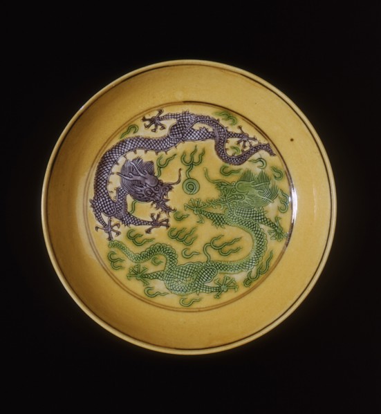 Green and aubergine dragons on yellow ground saucer, Guangxu period, Qing dynasty, China, 1875-1908. Artist: Unknown