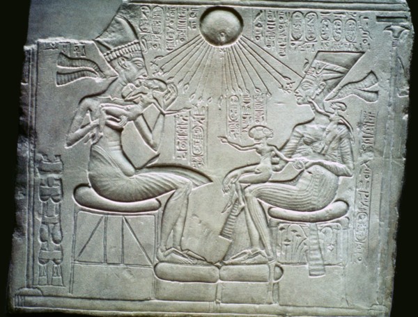 Egyptian relief of Akhenaten and Nefertiti holding their daughters, 14th century BC. Artist: Unknown