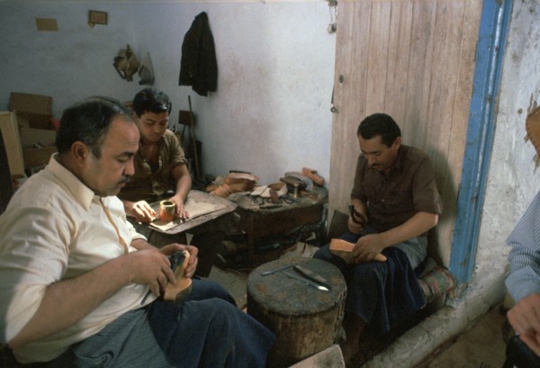 Shoemakers in a Tunisian souk. Artist: Unknown