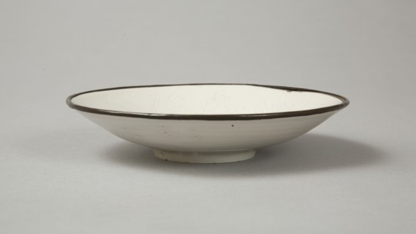 Small Ding-type bowl with incised peony scroll and dragon, 20th century. Artist: Unknown.