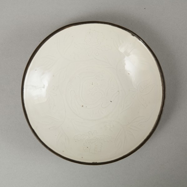 Small Ding-type bowl with incised peony scroll and dragon, 20th century. Artist: Unknown.