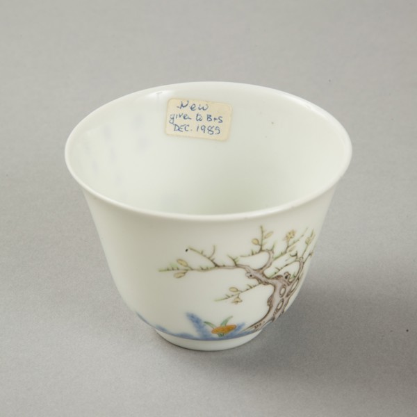 Underglaze blue month cup with polychrome enamelled decoration of a prunus tree. Artist: Unknown.