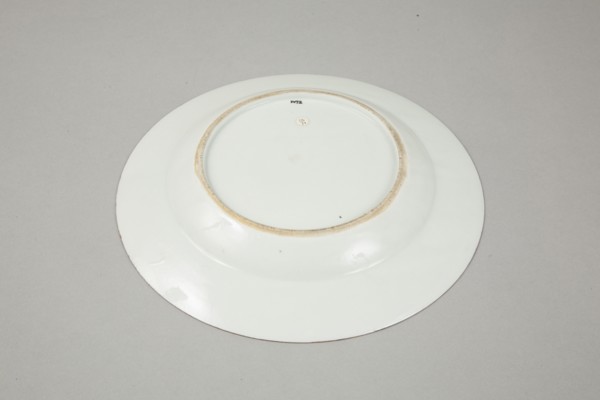 European copy of famille noire plate with cockerel looking at a butterfly, 20th century. Artist: Unknown.