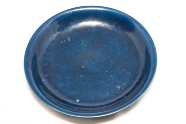 Deep blue dish with carved dragon design, 1522-1566. Artist: Unknown.