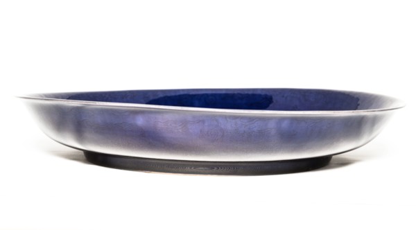 Deep aubergine dish with carved dragons chasing flaming pearl, 1662-1722. Artist: Unknown.