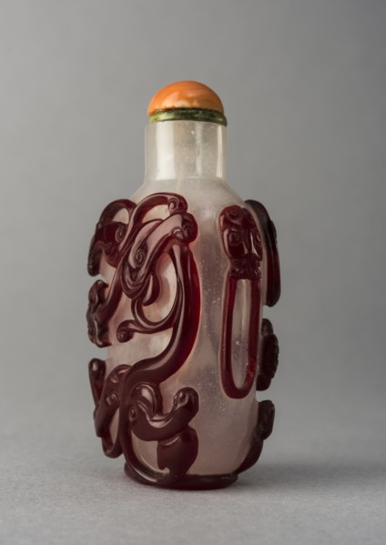 Clear glass snuff bottle with red overlay, China, Qing dynasty, 1644-1911. Creator: Unknown.