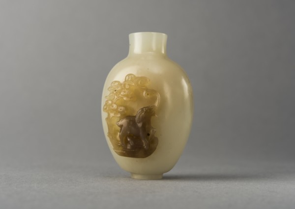 Jade snuff bottle with raised carving of animals, China, Qing dynasty, 1644-1911. Creator: Unknown.