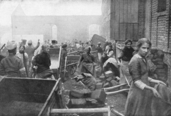 The inhabitants of Caudry come to seek food from the British Army, France, 1918. Artist: Unknown