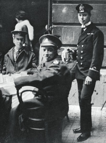 Sub-Lieutenant Prince Albert serving tea to wounded soldiers at Buckingham Palace, 1916. Artist: Unknown