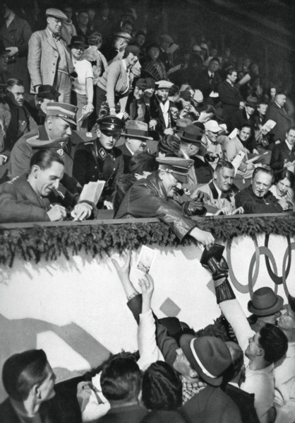 Adolf Hitler signs autographs, Winter Olympic Games, Garmisch-Partenkirchen, Germany, 1936.Artist: Schirner