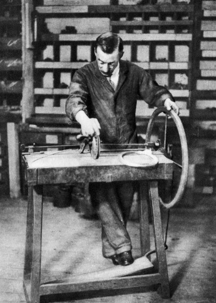 Wire being wound into springs for spring-locks, London, 1926-1927. Artist: Unknown