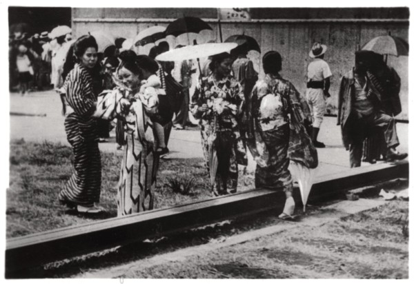 Japanese women by the Zeppelin hangar, Kasumigaura, Japan, 1929 (1933). Artist: Unknown
