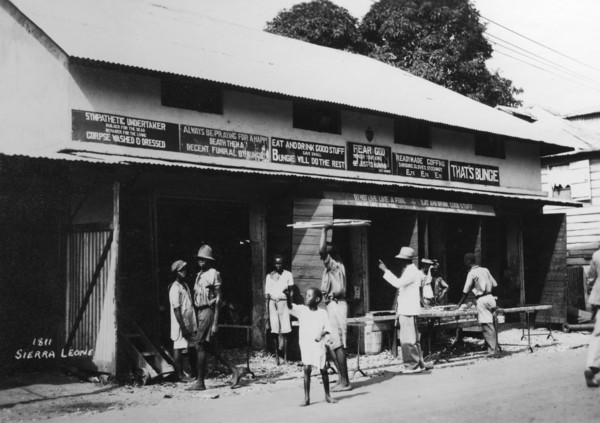 People outside an undertaker's premises, Sierra Leone, 20th century. Artist: Unknown