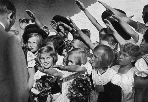 Adolf Hitler with a group of young children, 1936. Artist: Unknown