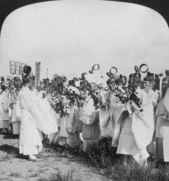 Shinto priests in a funeral procession for 'Hitachi Maru' victims, Tokyo, Japan, 1905. Artist: HC White
