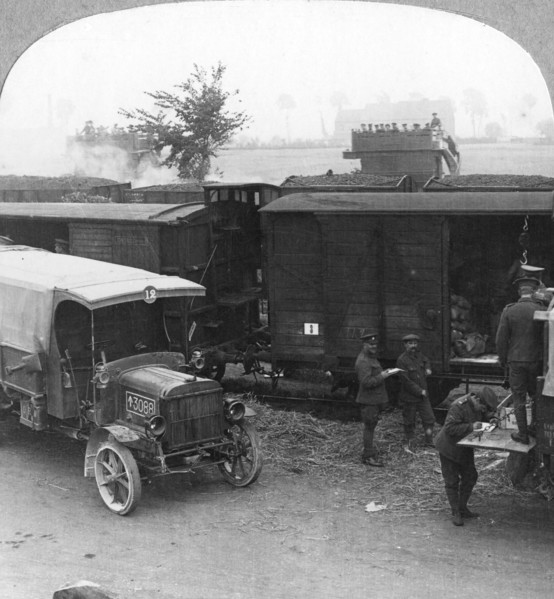 Troops and supplies are rushed from a railhead to the firing line, World War I, c1914-c1918. Artist: Realistic Travels Publishers