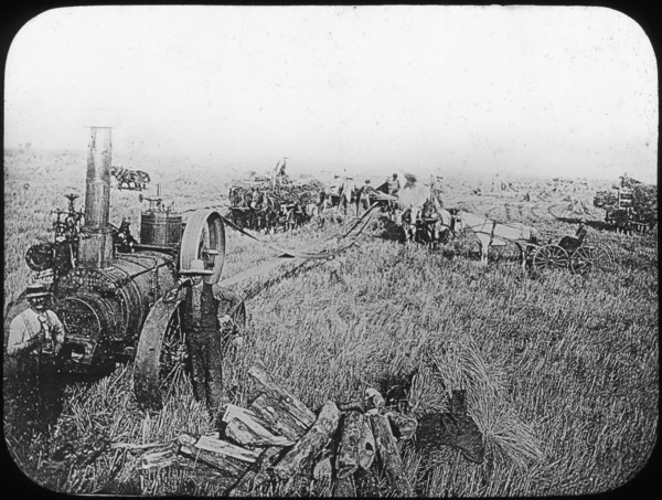 Harvest scene on the North American prairies, late 19th or early 20th century. Artist: George Philip & Son Ltd