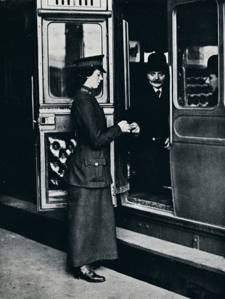 A woman ticket inspector at work, c1914. Artist: Unknown