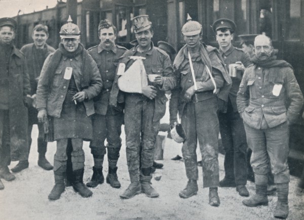 Some cheerful wounded from the Neuve Chapelle fighting, wearing captured German helmets, 1915. Artist: Unknown