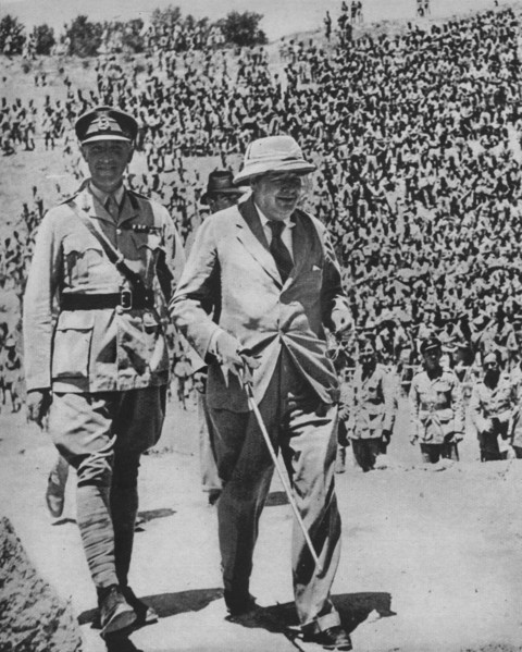 'Home via the Battlefields - Mr Churchill in the ancient Roman amphitheatre at Carthage', 1943-44. Artist: Unknown.