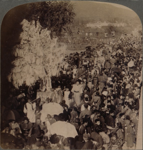 ''Shinto procession carrying sacred objects over bridge to Imperial Museum, Kyoto, Japan', 1904. Artist: Unknown.