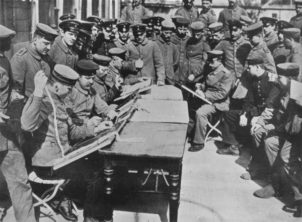 'The treatment of German wounded', 1915. Artist: Unknown.