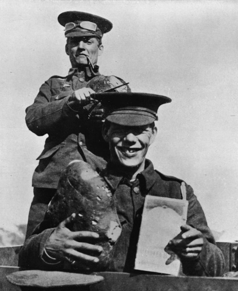 'The Soldier and his Rations: A photograph taken at one of the British camps in France', 1914. Artist: Unknown.