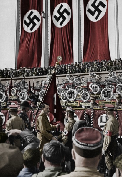 Adolf Hitler dedicates new standards, Nuremberg Rally, Germany, 1934.  Artist: Unknown.