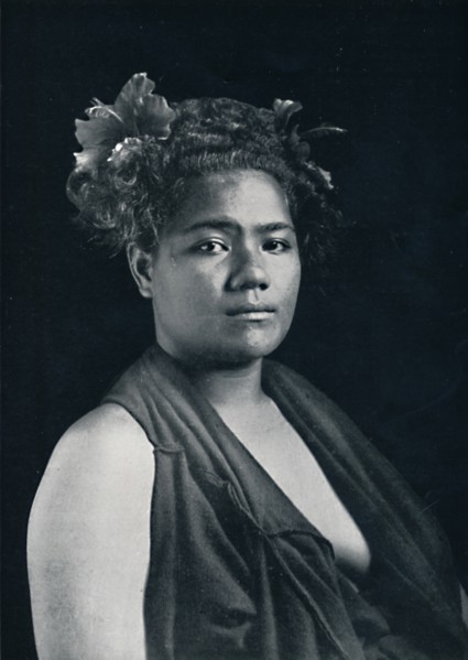 A Tongan woman, with scarlet hibiscus blossoms in her hair, 1902. Artist: JJ Lister.