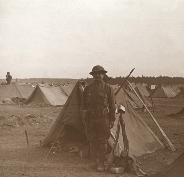 Soldier standing by tent, American camp, Melette, France, c1914-c1918.  Artist: Unknown.