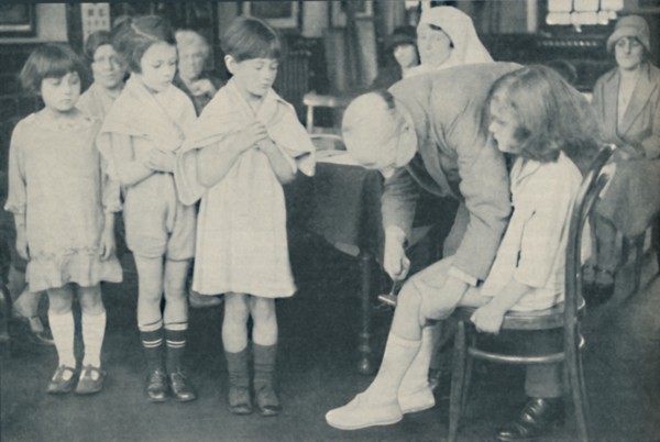 ' Testing the patella reflex for indication of nervous disease', c1935. Artist: Unknown.
