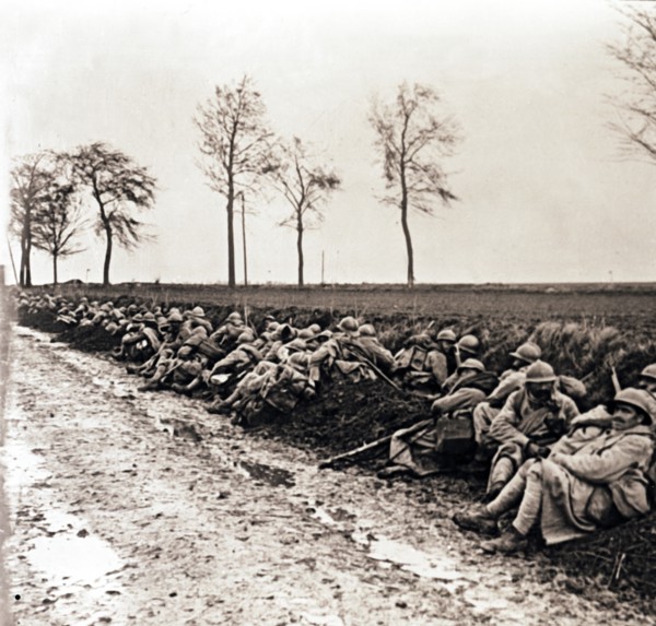 Troops resting by the side of a road, northern France, c1914-c1918. Artist: Unknown.