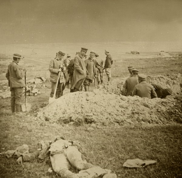 Burying bodies, Sainte-Marie-à-Py, northern France, c1914-c1918.  Artist: Unknown.