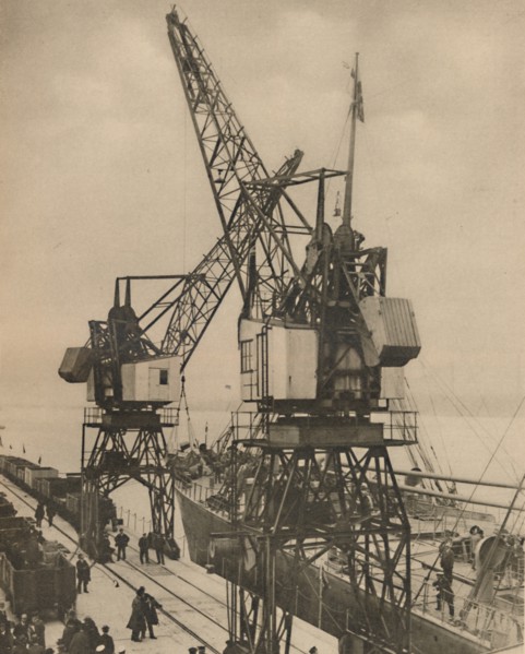 'Huge Mobile Cranes at Tilbury Swing the Cargo from a Vessel's Hold', c1935. Creator: Unknown.