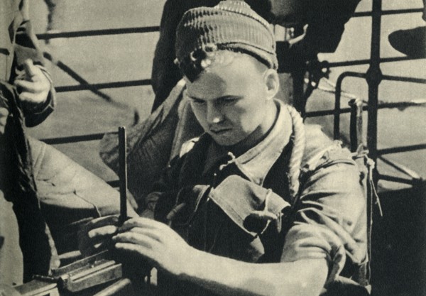 Royal Marine checking his machine gun, World War II, c1939-c1943 (1944). Creator: Unknown.