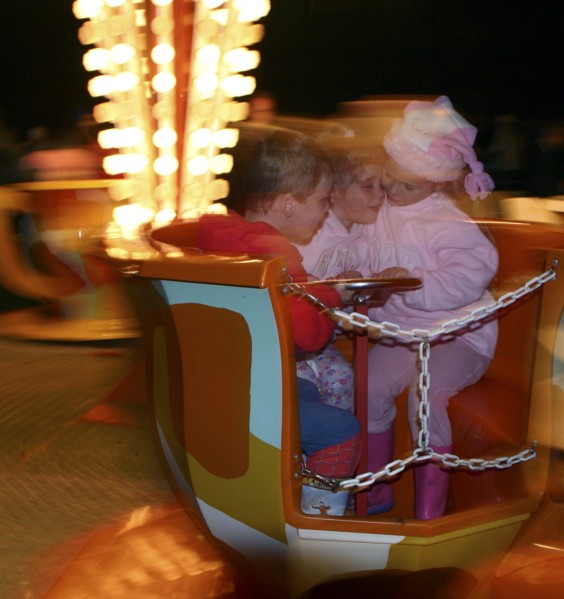 Children on a fairground ride, 2005