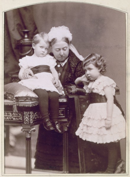 Queen Victoria with two of her grandchildren, April 1886. Artist: Alexander Bassano