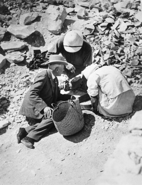 Sifting the dust from the floor of the Tomb of Tutankhamun, Valley of the Kings, Egypt, 1922. Artist: Harry Burton
