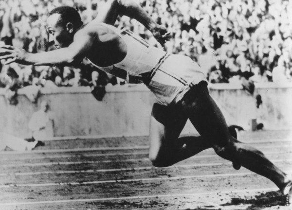 Jesse Owens, American athlete, competing in the Olympics in Berlin, Germany, 1936. Artist: Unknown