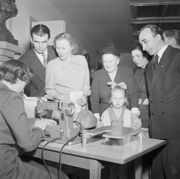 A woman demonstrates a sewing machine, Landskrona, Sweden, 1951. Artist: Unknown