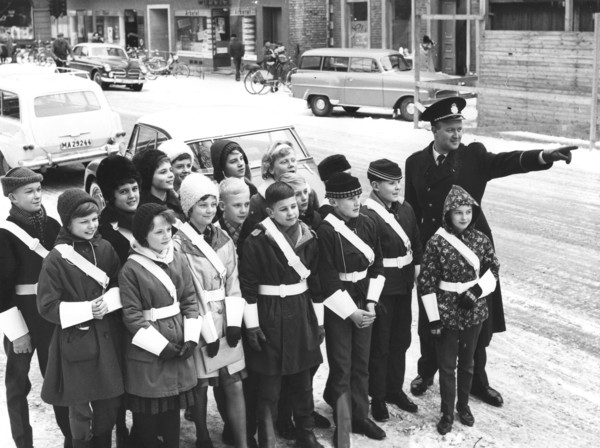 A policeman teaches a group of schoolchildren how to be traffic officers, Sweden, c1956-1969(?). Artist: Unknown