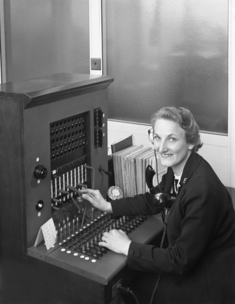 Switch board operator, Spillers Animal Foods, Gainsborough, Lincolnshire, 1960. Artist: Michael Walters