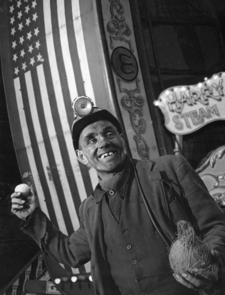 Miner at a fairground, Conisbrough, near Doncaster, South Yorkshire, 1955. Artist: Michael Walters