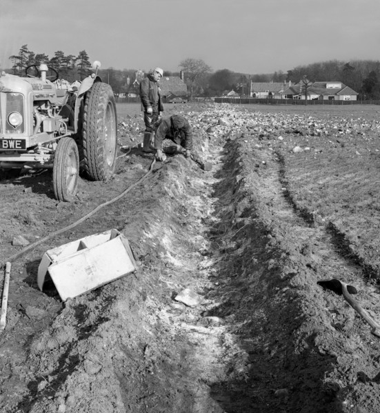 Contractors setting explosives in a trench in Firbeck, near Rotherham, 1962.  Artist: Michael Walters
