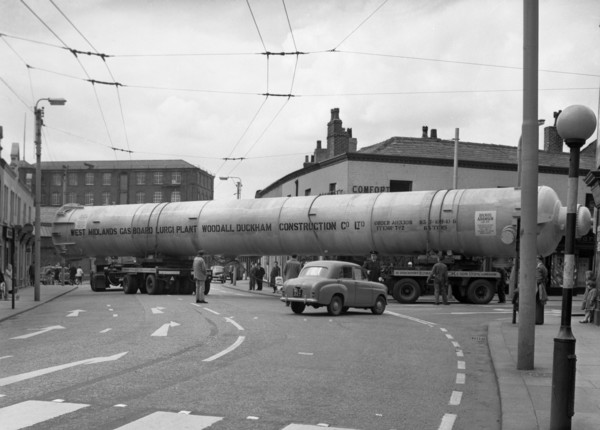 A heavy load stops the Manchester traffic, 1962.  Artist: Michael Walters