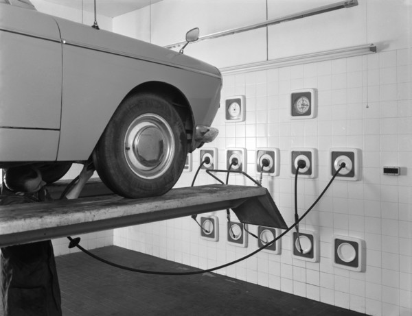 A traditional lubrication bay and mechanic at a garage, Sheffield, South Yorkshire, 1965. Artist: Michael Walters