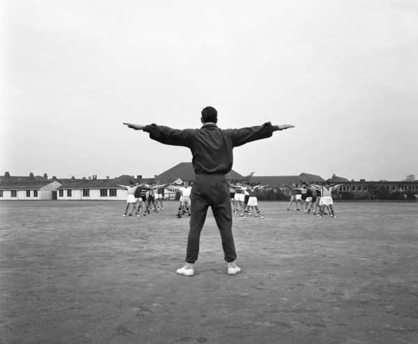 Games master taking a gym class, Airedale school, Castleford, West Yorkshire, 1962. Artist: Michael Walters