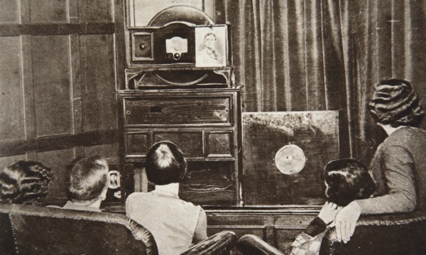 People watching an early television transmission, c1920s. Creator: Unknown.