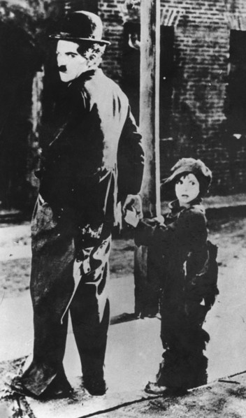 Charlie Chaplin and Jackie Coogan in 'The Kid', 1921. Artist: Unknown