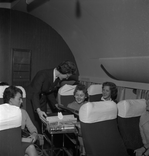 SAS stewardess serving on a flight, 1960. Artist: Torkel Lindeberg